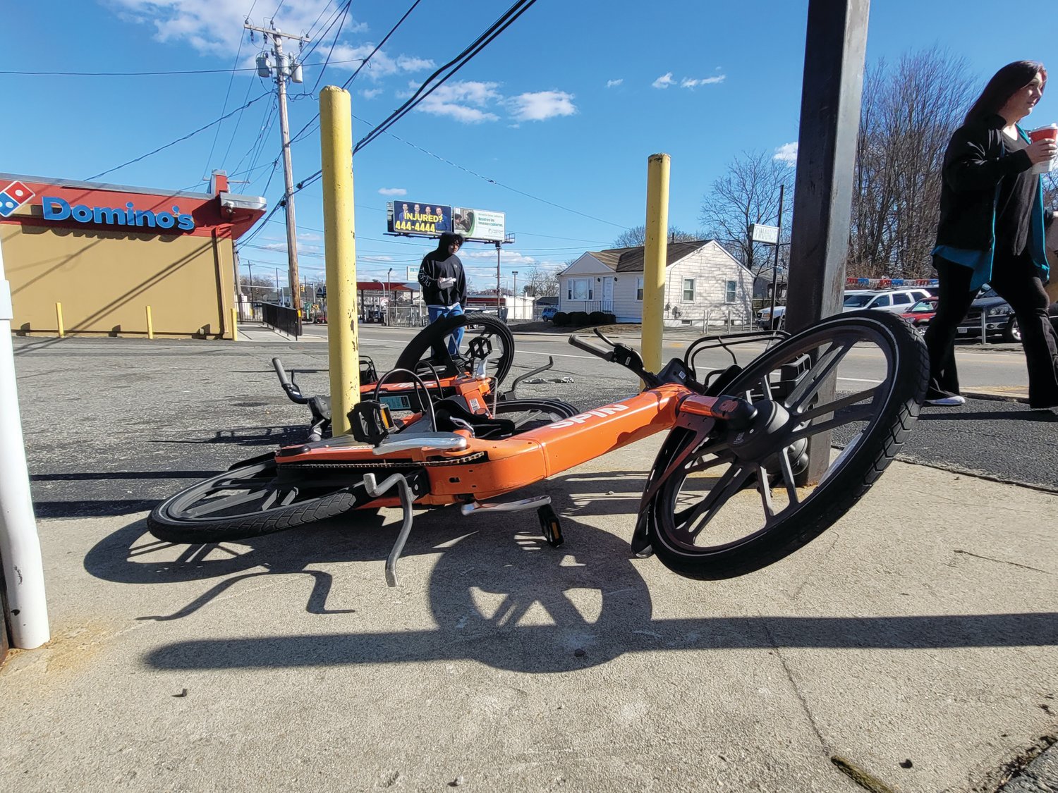 PILING UP: The abandoned electronic bikes and scooters are starting to pile up at locations in Johnston, like this spot on Hartford Avenue near the Providence line. If a Johnston ordinance is approved, police will be able to impound the bikes and scooters and levy fines.